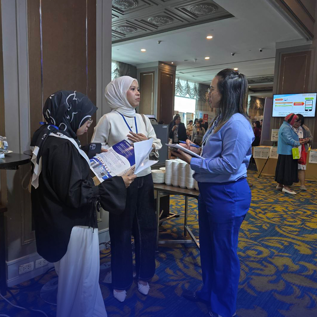 Advising customers at the booth